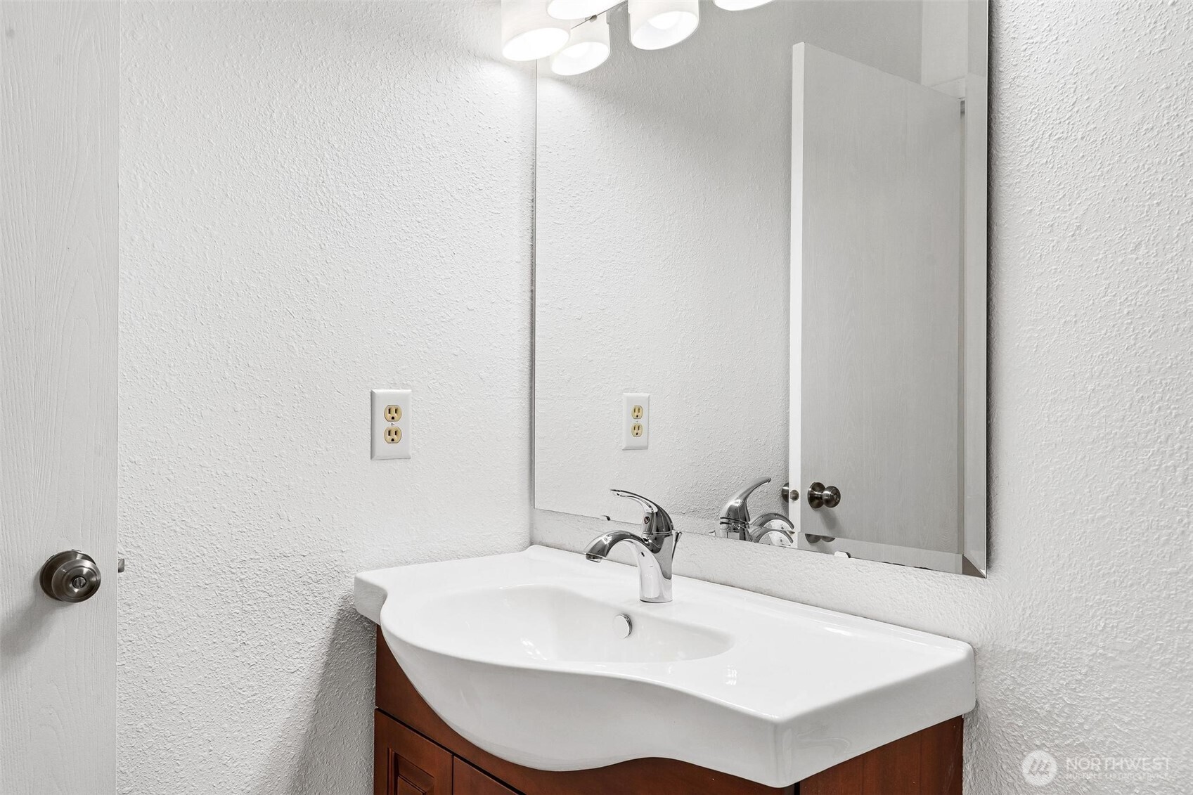 5832 Northeast 75th Street, Unit E304 Seattle, WA 98115 - Photo 23 of 36 a bathroom with a sink and a mirror