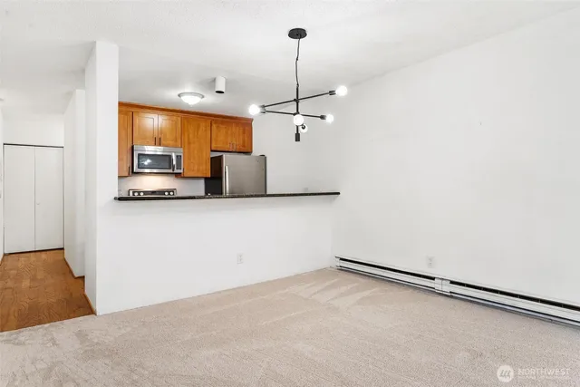 a kitchen with granite countertop cabinets and window