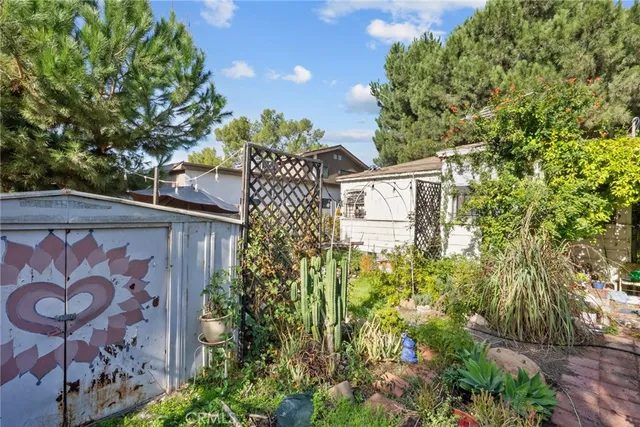 a white car parked in front of a house