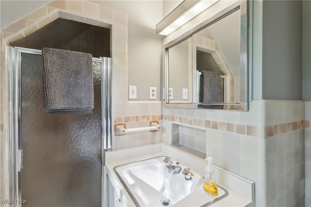 800 Merriman Road Akron, OH 44303 - Photo 22 of 42 Bathroom with a shower stall and vanity