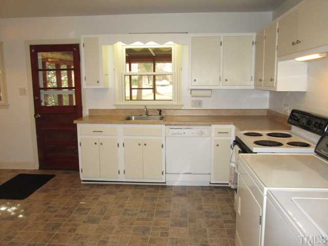 1408 Southerlund Road Garner, NC 27529 - Photo 14 of 25 Kitchen features new flooring 2012, new counter tops 2012, kitchen cabinets were painted 2011, new brush nickel hardware 2012 & nice stainless steel farm sink bowl!