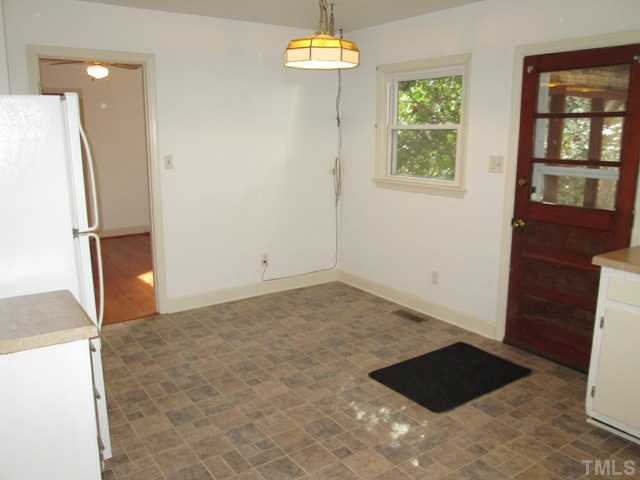 1408 Southerlund Road Garner, NC 27529 - Photo 16 of 25 Here you can see the breakfast area and the door leading to the living room! Updated door knobs and updated front door!