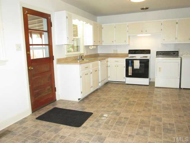 1408 Southerlund Road Garner, NC 27529 - Photo 17 of 25 Here is one last view of the lovely kitchen! Lots of cabinet and counter space! Home features all new vinyl champion tilt in double hung windows with locks & screens!