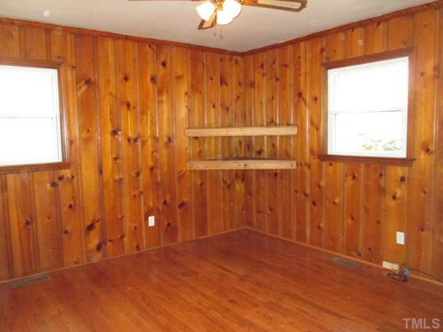 1408 Southerlund Road Garner, NC 27529 - Photo 19 of 25 Family room/office/play room has many uses! Real heart pine paneling, refinished hardwood floors and built ins! Great room for whatever you need!