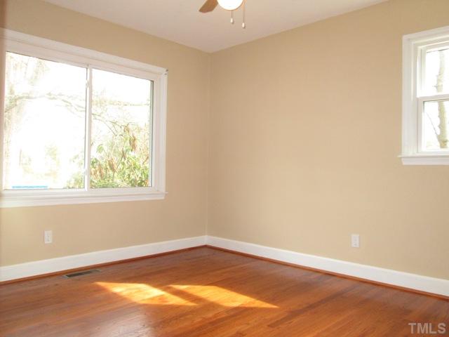 1408 Southerlund Road Garner, NC 27529 - Photo 21 of 25 Here is another one of the bedrooms! Beautiful hardwood floors! Windows help provide lots of natural light!
