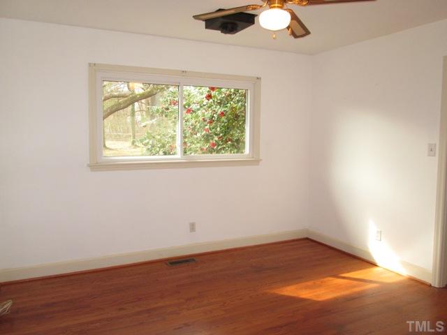 1408 Southerlund Road Garner, NC 27529 - Photo 22 of 25 Here is the third bedroom! More home features include me gutters, storm doors and all 3 pronged plugs!