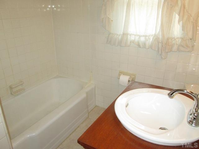 1408 Southerlund Road Garner, NC 27529 - Photo 24 of 25 Another view of the full bath! Updated plumbing fixtures and all new floor tile have recently been redone!