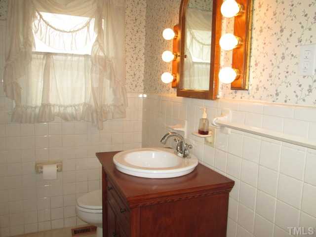 1408 Southerlund Road Garner, NC 27529 - Photo 25 of 25 Furniture style vanity adds a nice touch to this wonderful bathroom! Great home and wonderful established neighborhood!