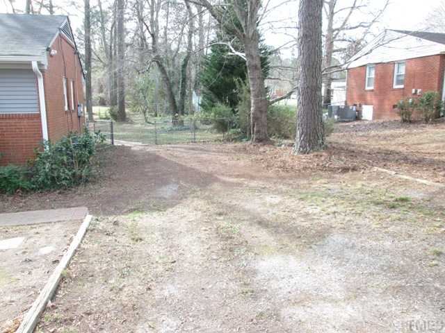 1408 Southerlund Road Garner, NC 27529 - Photo 8 of 25 Wonderful older neighborhood with lots of mature trees! Nice wide driveway looking into the large fenced in back yard!