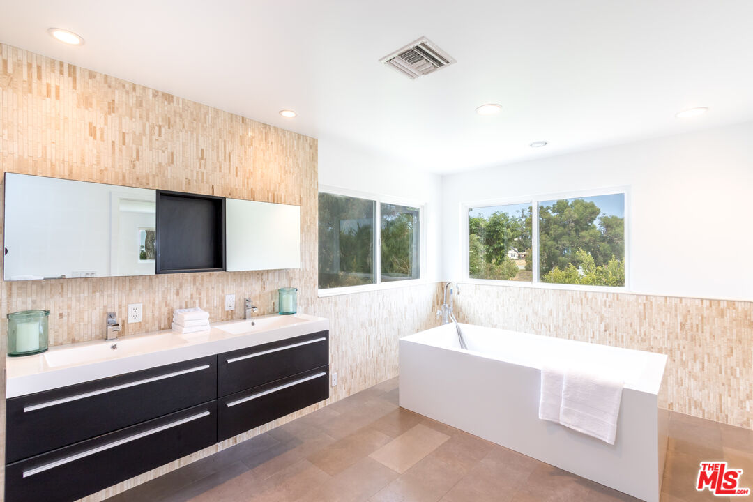 28929 Wight Road Malibu, CA 90265 - Photo 14 of 22 a bathroom with a sink and a bathtub