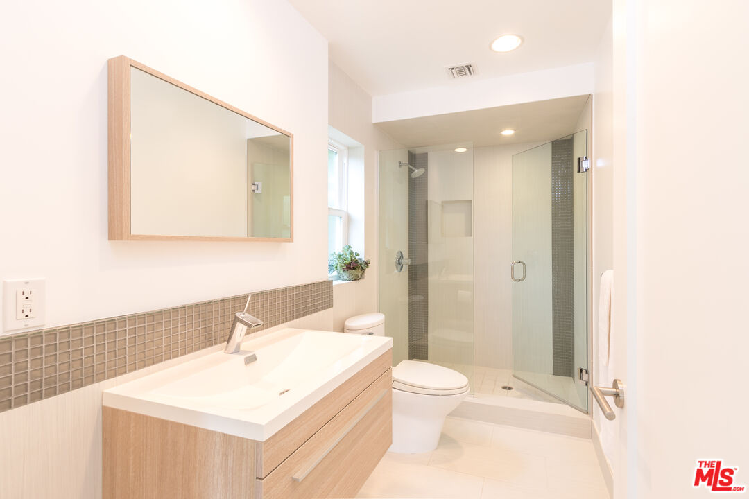 28929 Wight Road Malibu, CA 90265 - Photo 17 of 22 a bathroom with a sink a toilet and shower