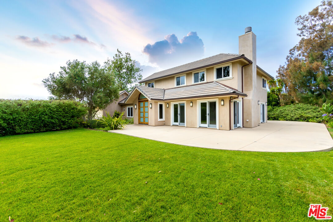 28929 Wight Road Malibu, CA 90265 - Photo 18 of 22 a front view of a house with a garden