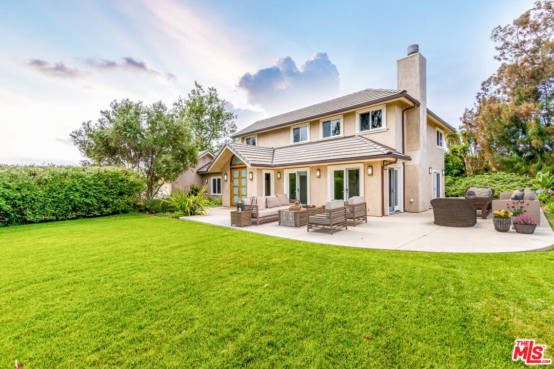 28929 Wight Road Malibu, CA 90265 - Photo 3 of 22 a front view of a house with swimming pool having outdoor seating
