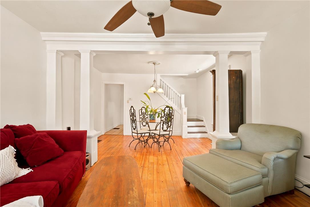 803 Spring Street Bethlehem, PA 18018 - Photo 6 of 34 Rich hardwood floors unite this inviting living space, flowing seamlessly into the dining area and staircase.