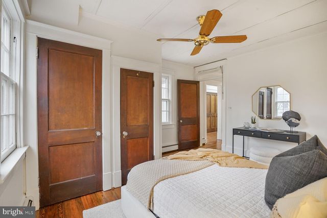 a bedroom with a bed and a lamp