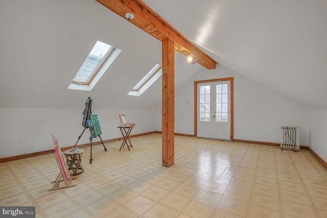 a view of a porch with wooden floor and furniture