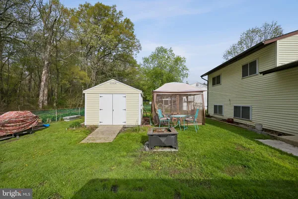 a house view with a sitting space and garden