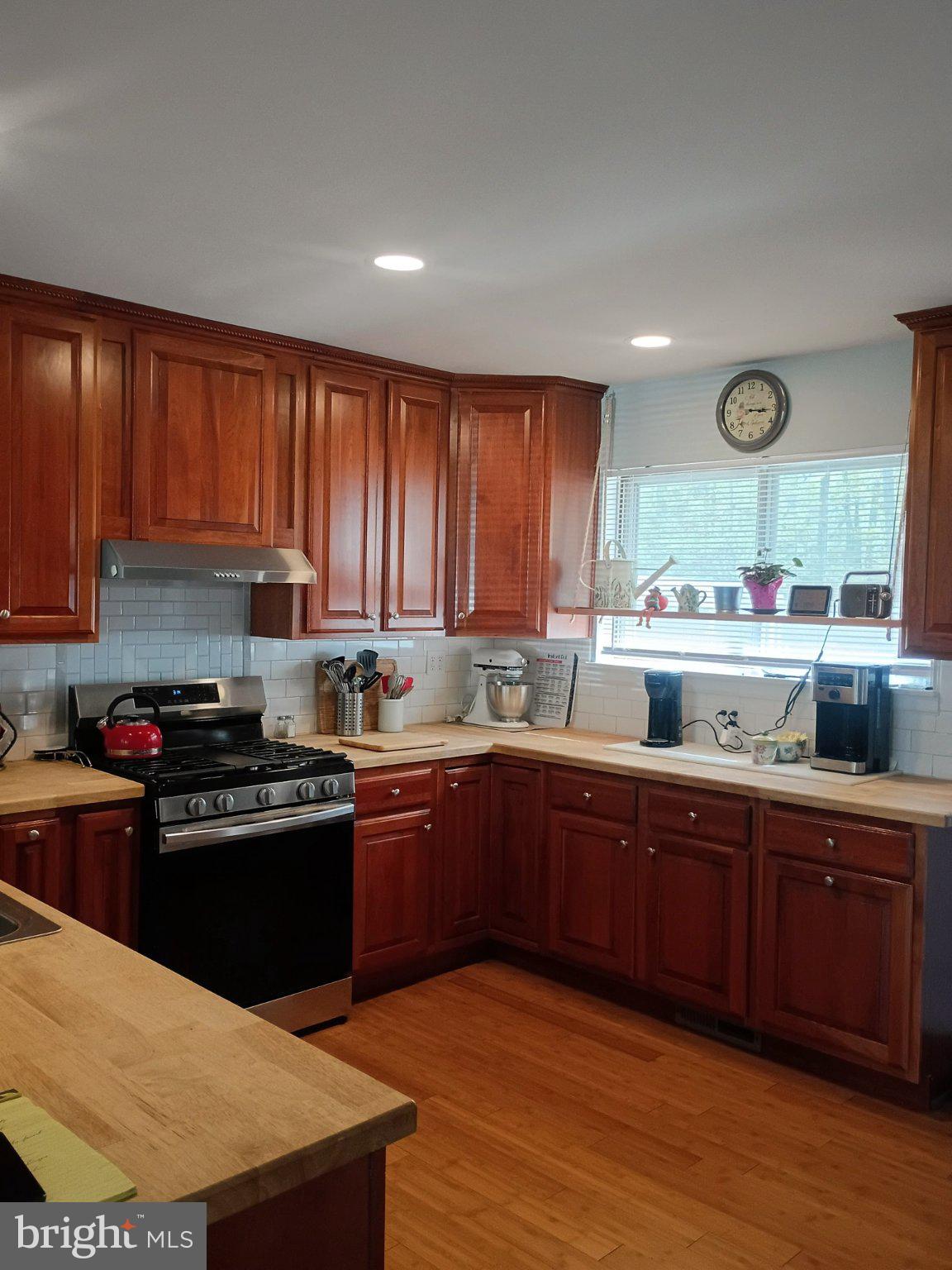 236 University Avenue Pemberton, NJ 08068 - Photo 2 of 5 Warm wood tones in a cozy kitchen.