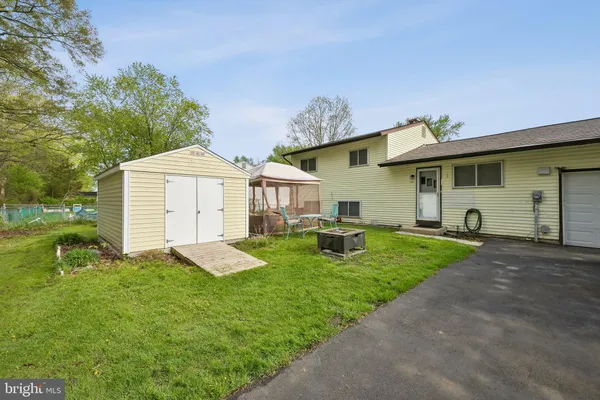 a front view of a house with a yard and porch