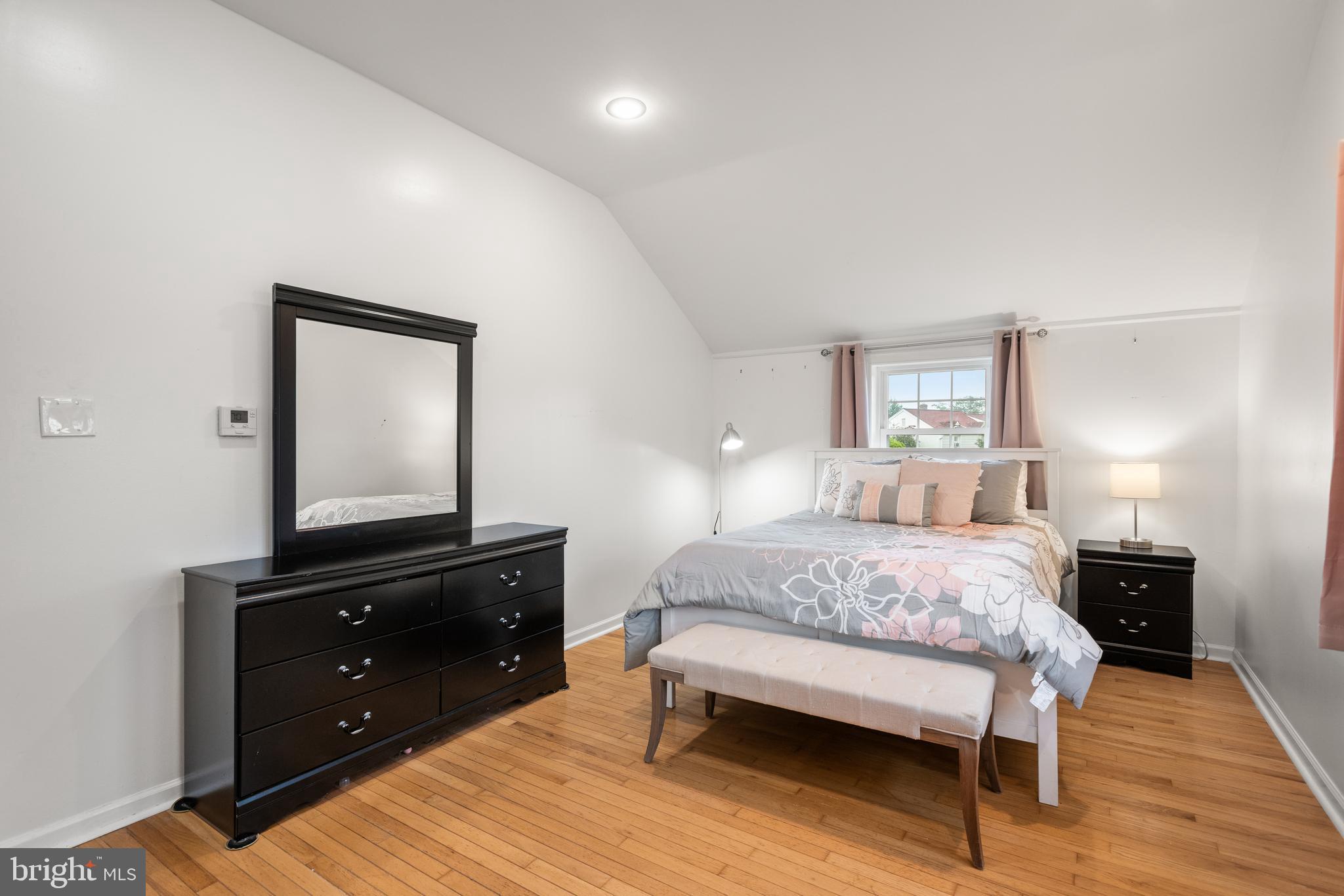 2335 Poe Road Secane, PA 19018 - Photo 11 of 15 a bedroom with a bed and a dresser