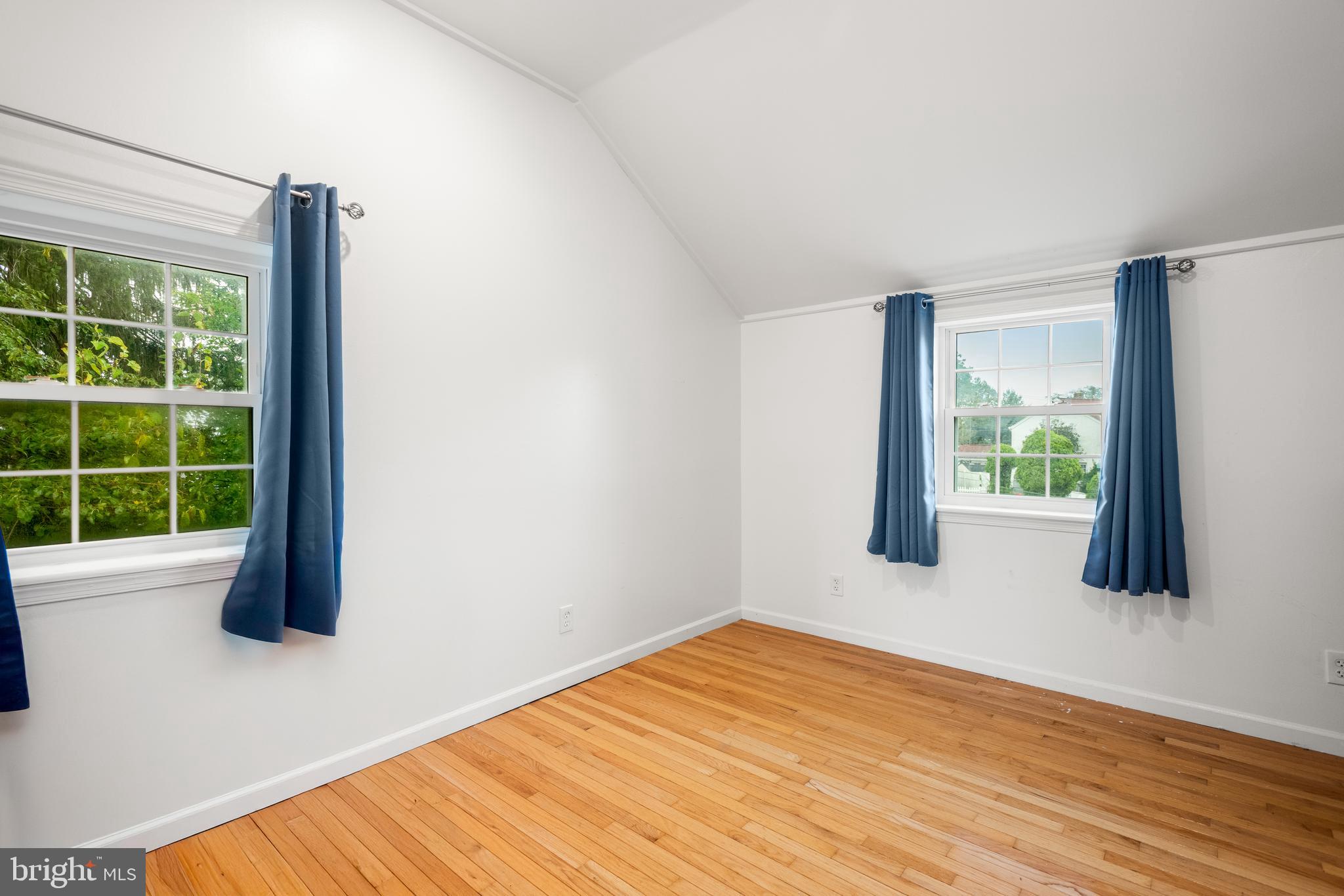 2335 Poe Road Secane, PA 19018 - Photo 12 of 15 a view of an empty room with wooden floor and a window