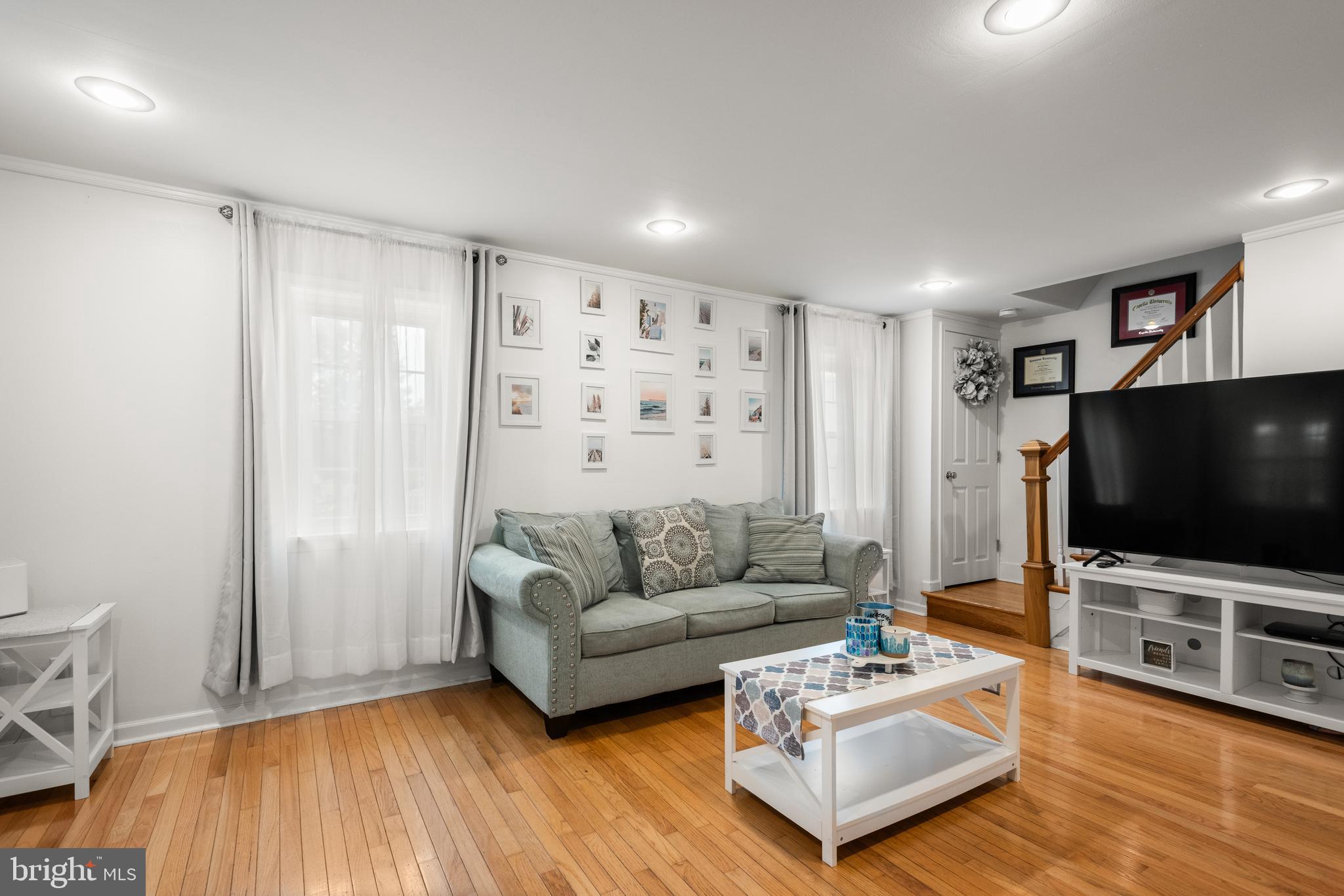 2335 Poe Road Secane, PA 19018 - Photo 2 of 15 a living room with furniture and a flat screen tv