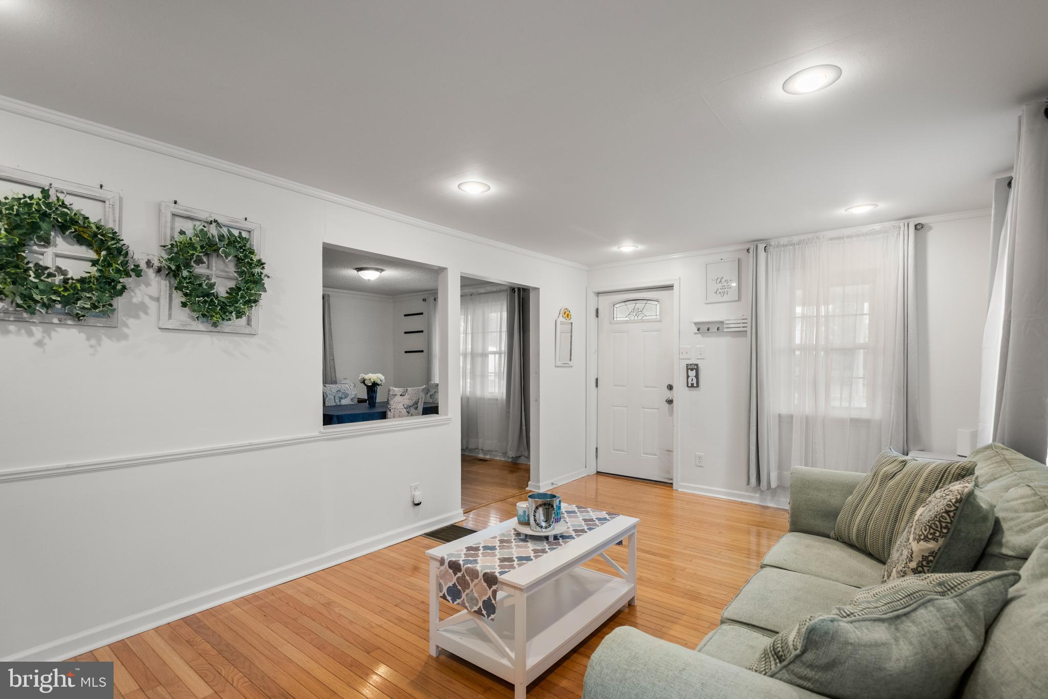 2335 Poe Road Secane, PA 19018 - Photo 5 of 15 a living room with furniture and a large window