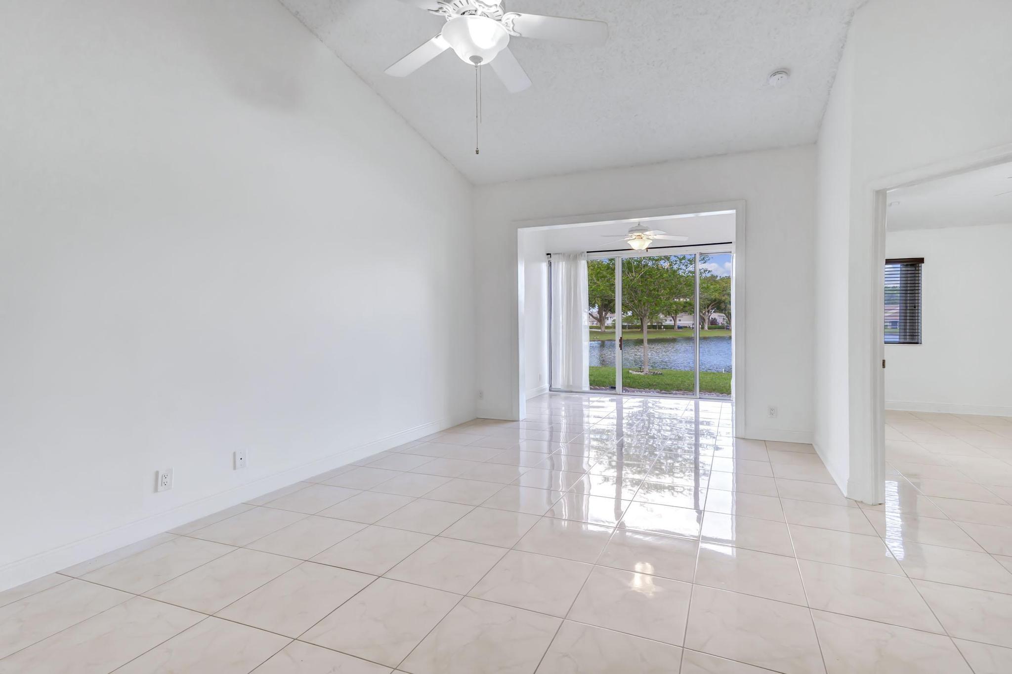 9130 Vineland Court, Unit C Boca Raton, FL 33496 - Photo 14 of 81 a view of a livingroom with a floor to ceiling window