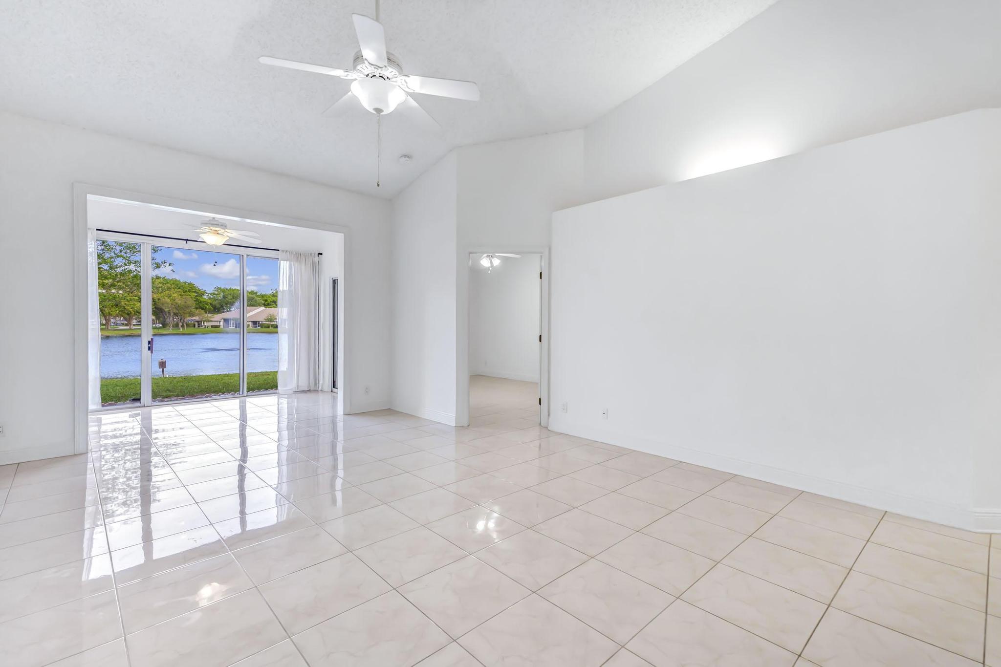 9130 Vineland Court, Unit C Boca Raton, FL 33496 - Photo 26 of 81 wooden floor in an empty room with a window