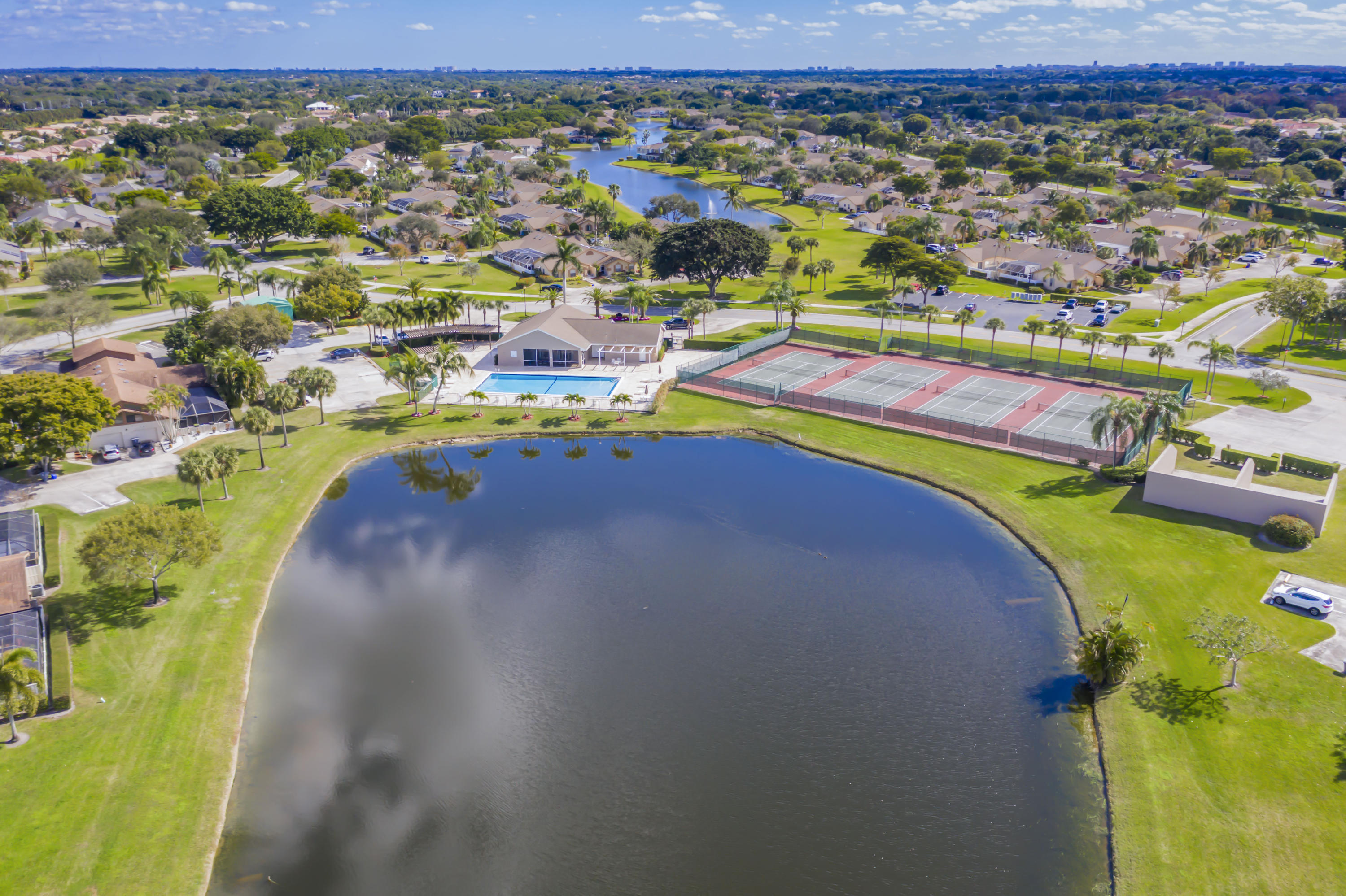 9130 Vineland Court, Unit C Boca Raton, FL 33496 - Photo 34 of 81 an aerial view of a houses with a swimming pool