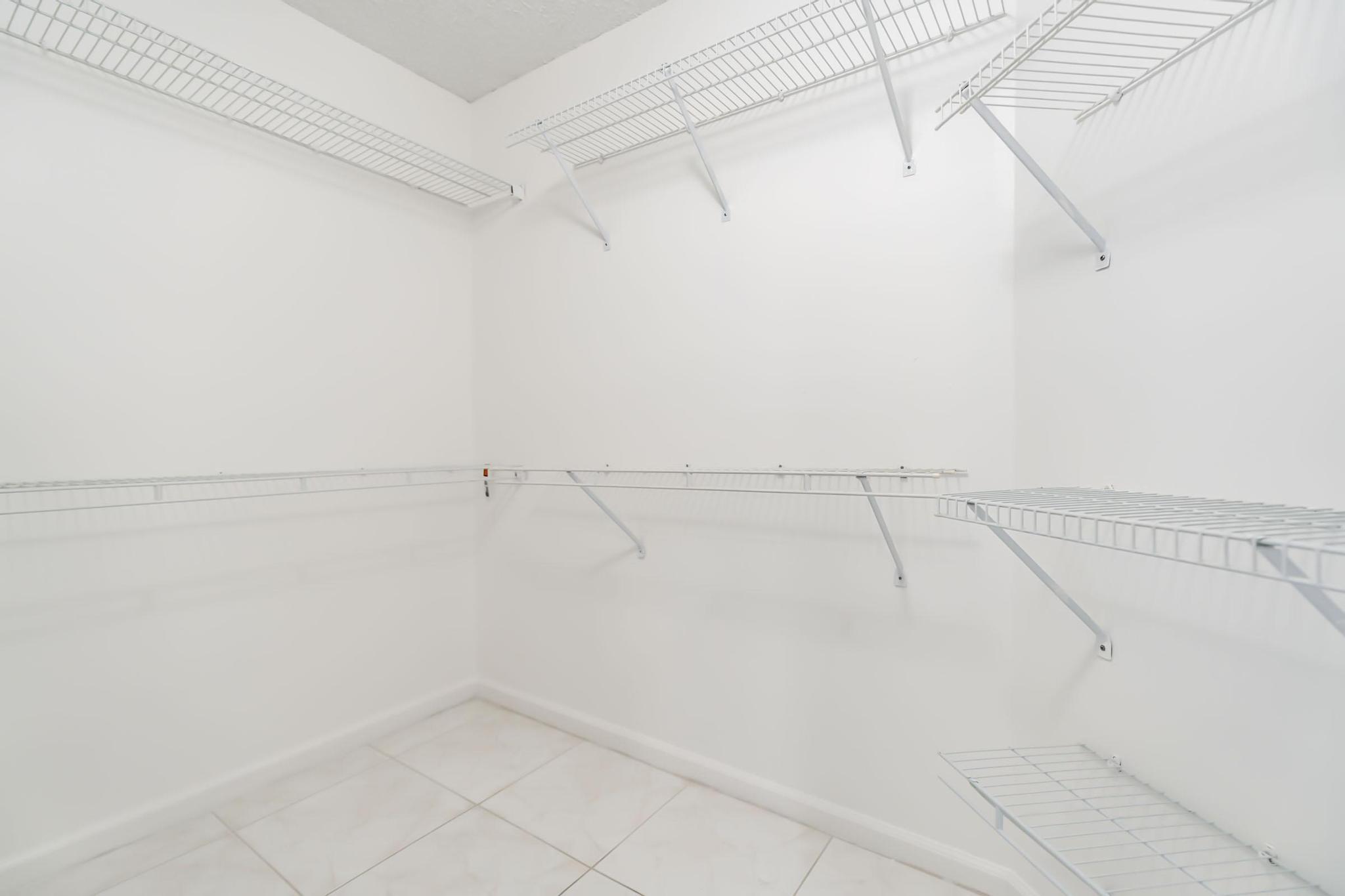 9130 Vineland Court, Unit C Boca Raton, FL 33496 - Photo 43 of 81 a view of a rack on the wall