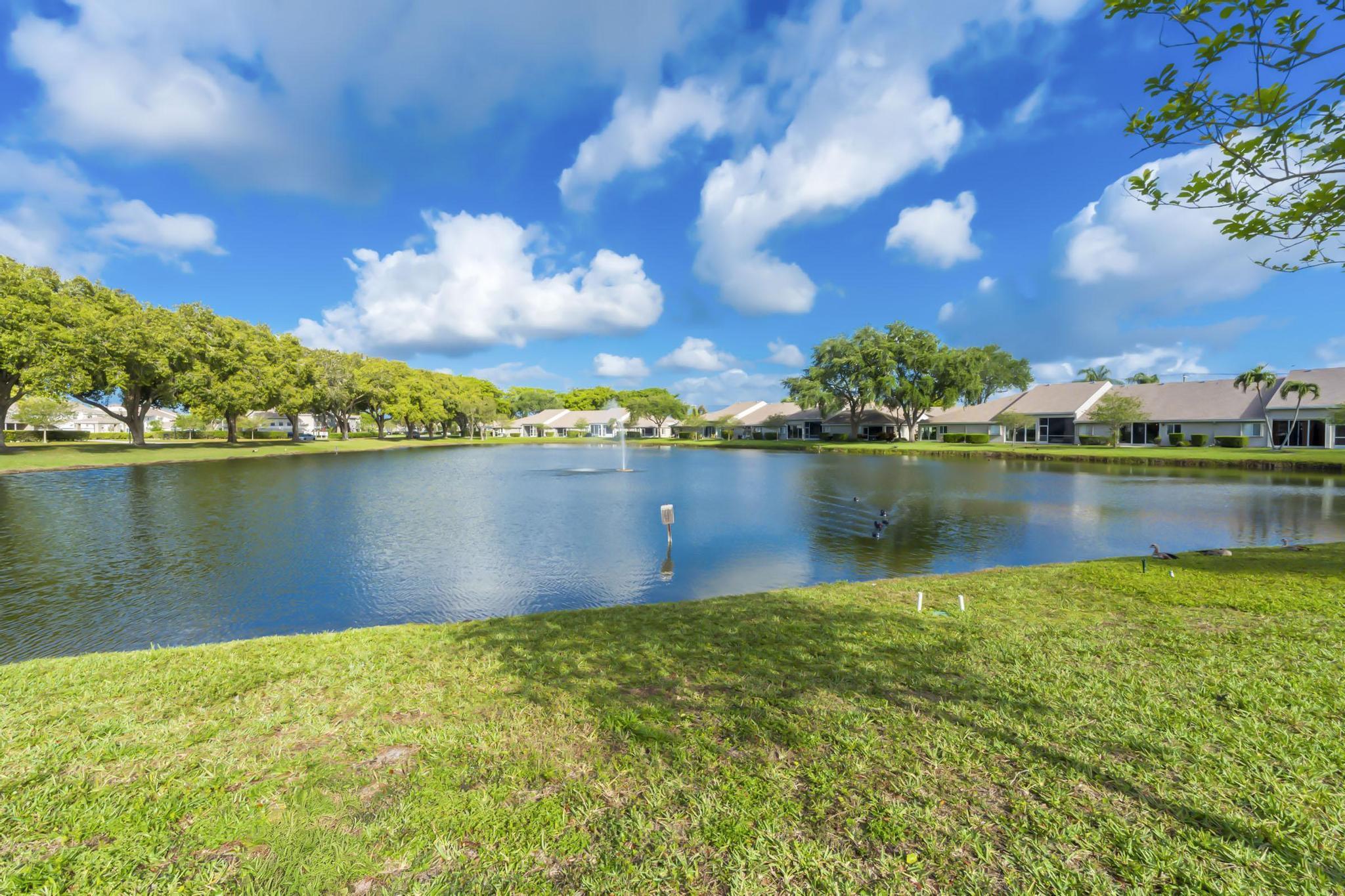 9130 Vineland Court, Unit C Boca Raton, FL 33496 - Photo 47 of 81 a view of a lake with houses in the back