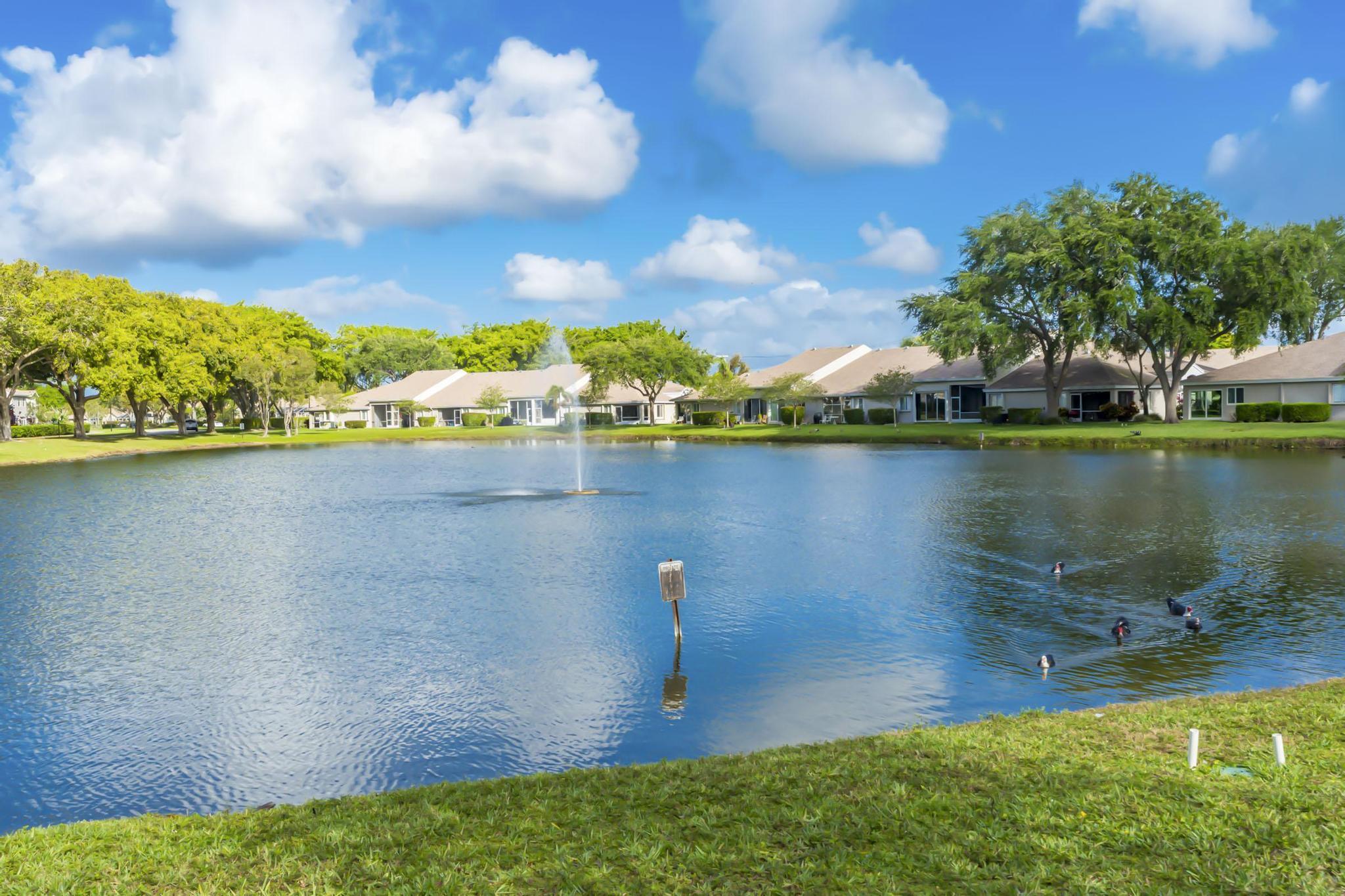 9130 Vineland Court, Unit C Boca Raton, FL 33496 - Photo 48 of 81 a view of a lake with a city view