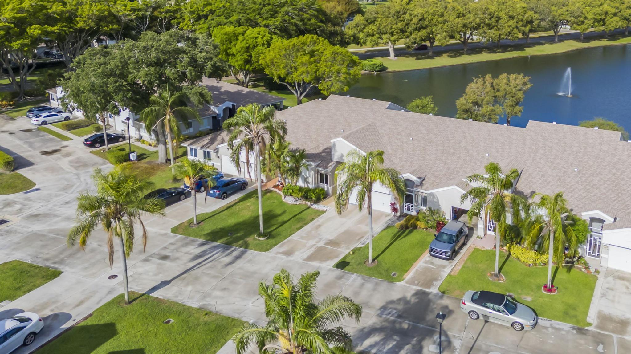 9130 Vineland Court, Unit C Boca Raton, FL 33496 - Photo 56 of 81 an aerial view of a house with outdoor space and a lake view