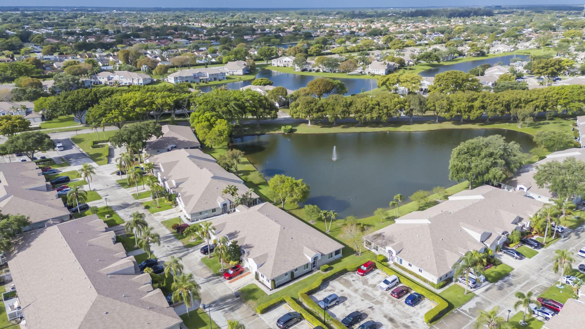 9130 Vineland Court, Unit C Boca Raton, FL 33496 - Photo 60 of 81 an aerial view of lake and residential houses with outdoor space