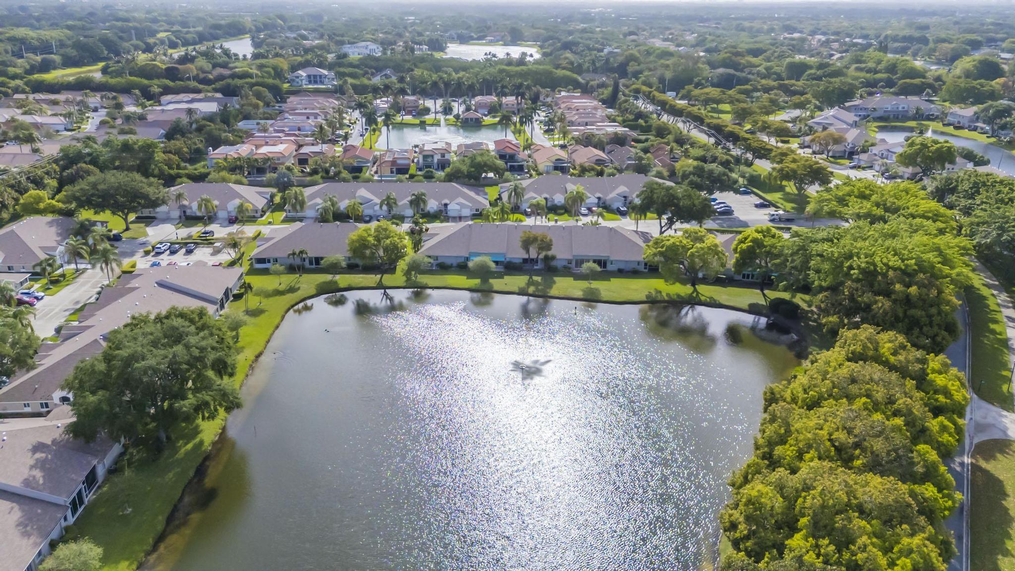 9130 Vineland Court, Unit C Boca Raton, FL 33496 - Photo 62 of 81 an aerial view of a house with a lake view