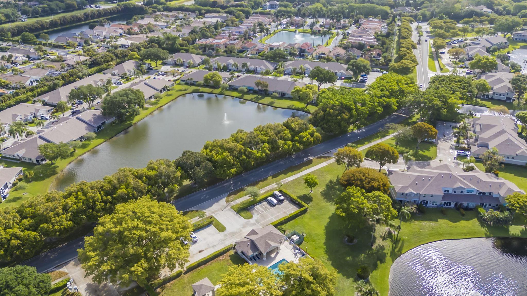 9130 Vineland Court, Unit C Boca Raton, FL 33496 - Photo 72 of 81 an aerial view of residential houses with outdoor space and swimming pool