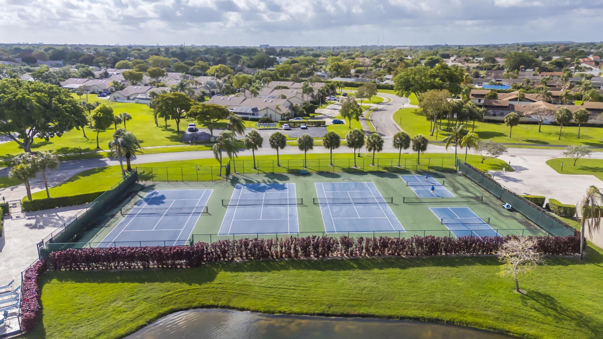 9130 Vineland Court, Unit C Boca Raton, FL 33496 - Photo 75 of 81 an aerial view of residential houses with outdoor space and swimming pool