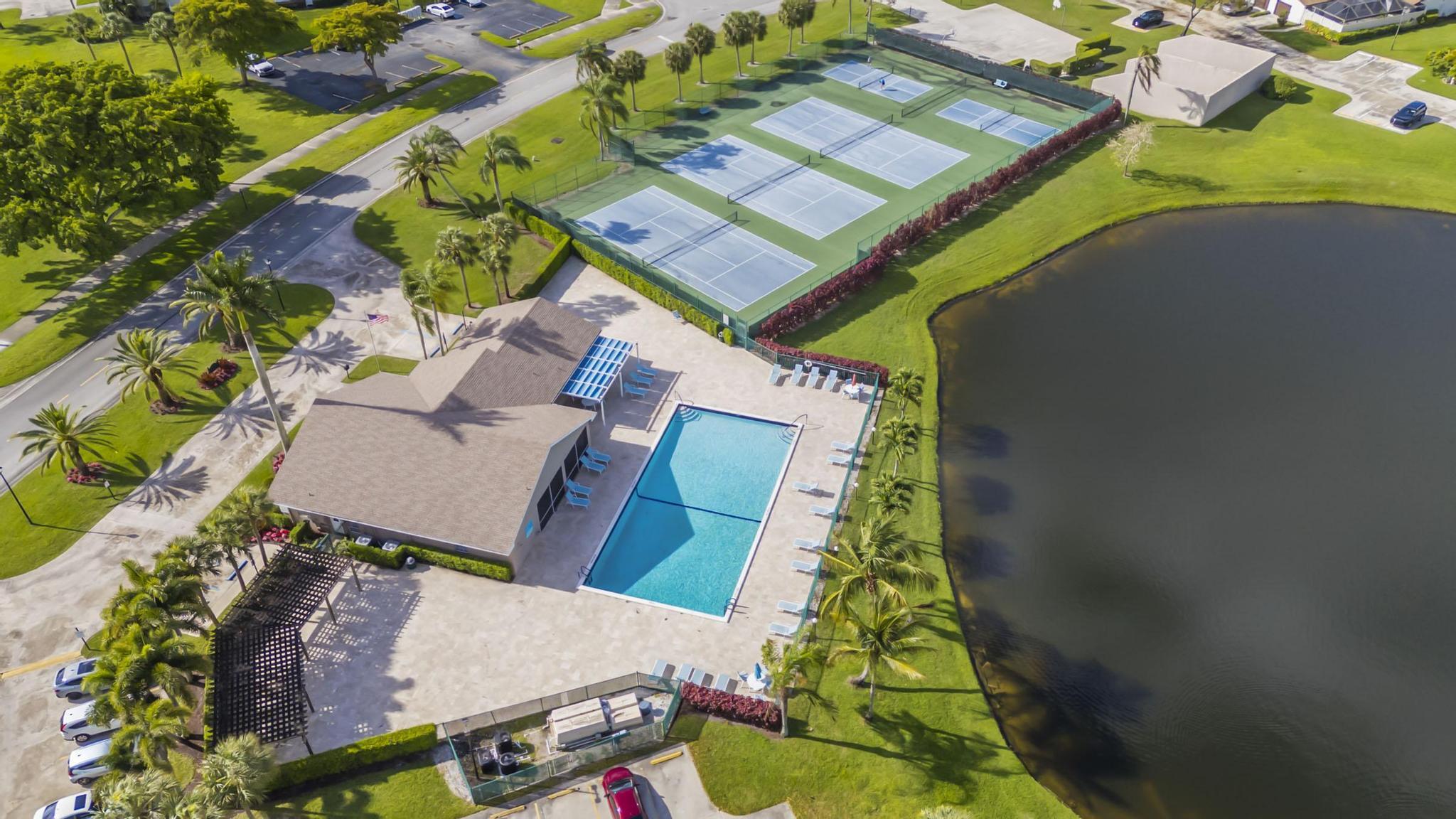 9130 Vineland Court, Unit C Boca Raton, FL 33496 - Photo 78 of 81 an aerial view of a house with a yard and potted plants