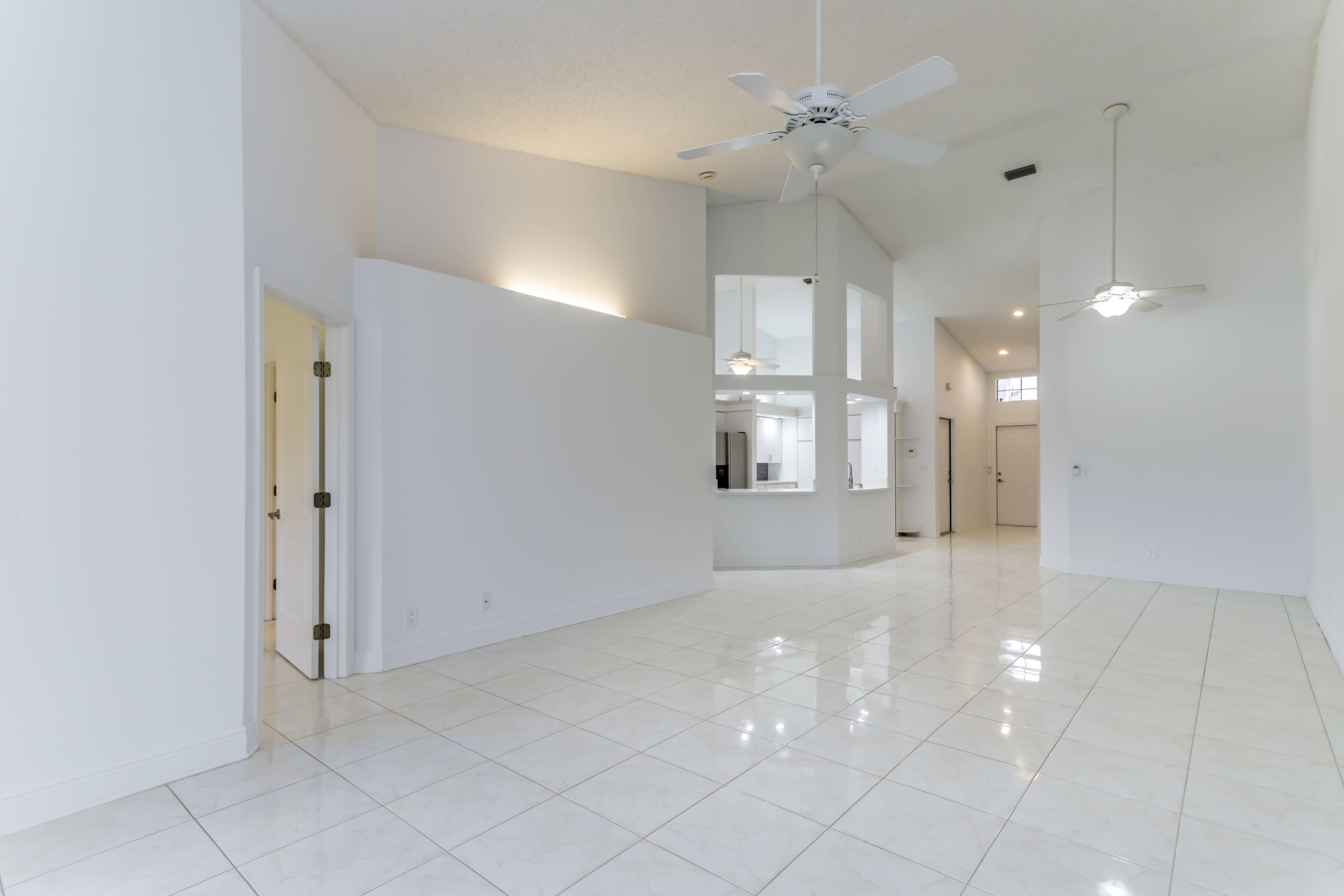 9130 Vineland Court, Unit C Boca Raton, FL 33496 - Photo 10 of 81 a view of a kitchen with a sink and a refrigerator