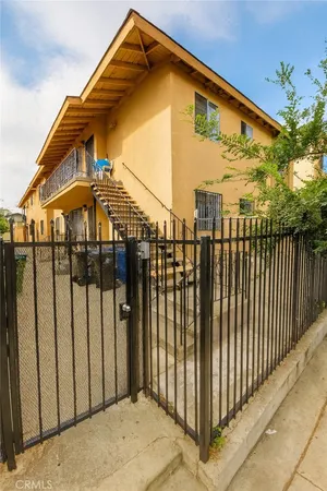 a view of a house with a small yard