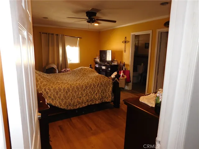 a bedroom with bed and window