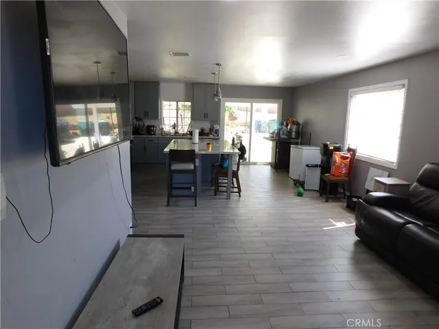 a view of a living room and dining room