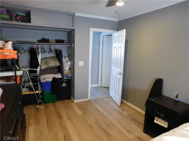 a bedroom with a bed and a desk