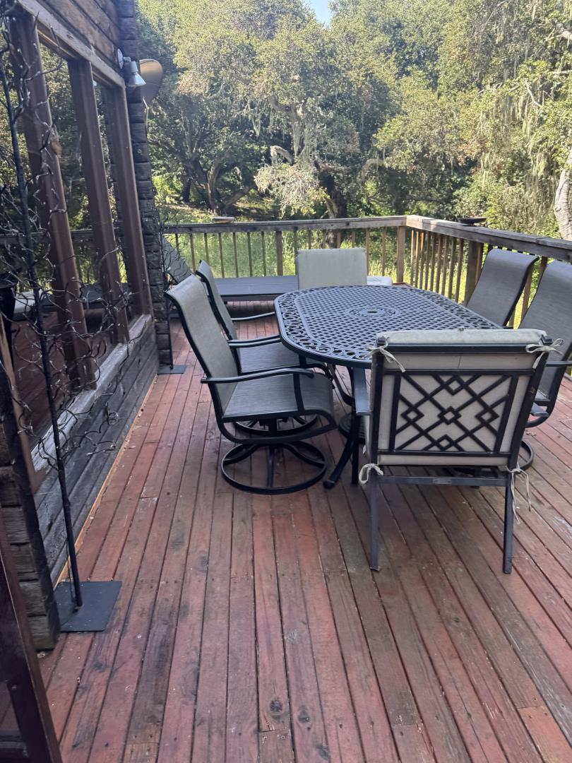 11521 Hidden Hills Road Carmel Valley, CA 93924 - Photo 26 of 26 a view of balcony with furniture and wooden floor