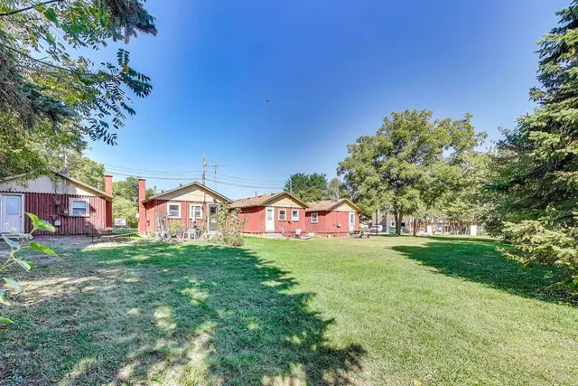 a view of a house with a big yard