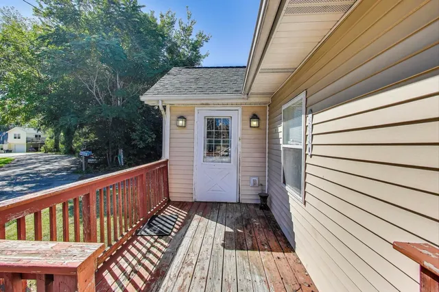 a view of backyard with a deck