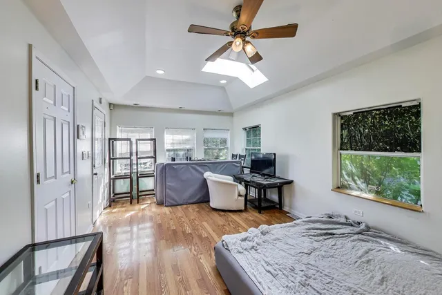 a view of a livingroom with furniture window and wooden floor