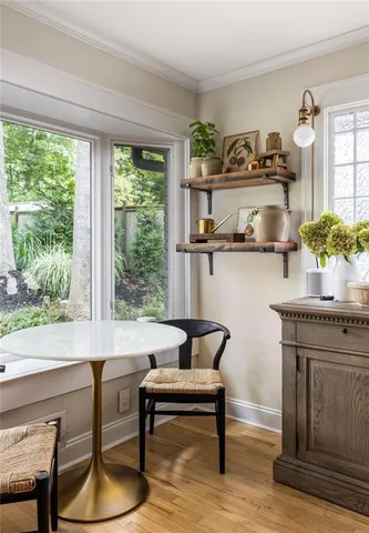 a bathroom with a granite countertop sink a mirror and shower