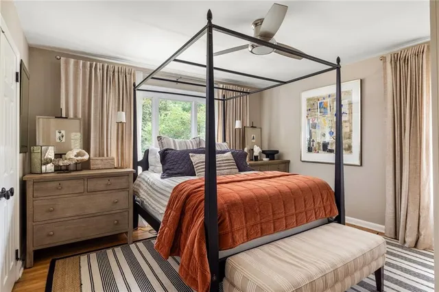 a view of a patio with table and chairs under an umbrella